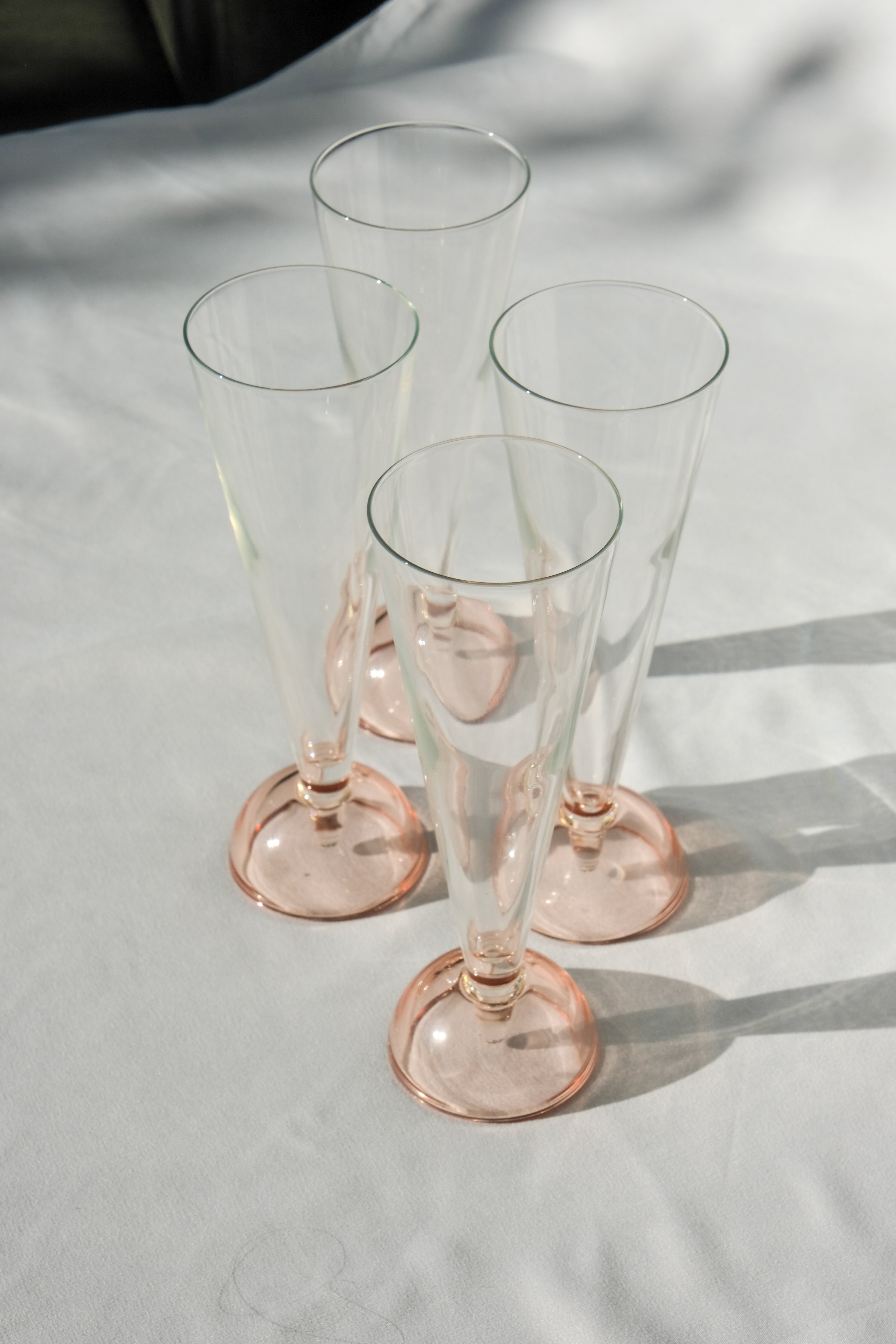 Set of four 90's flute glasses