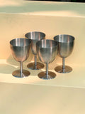 Set of four steel chalices
