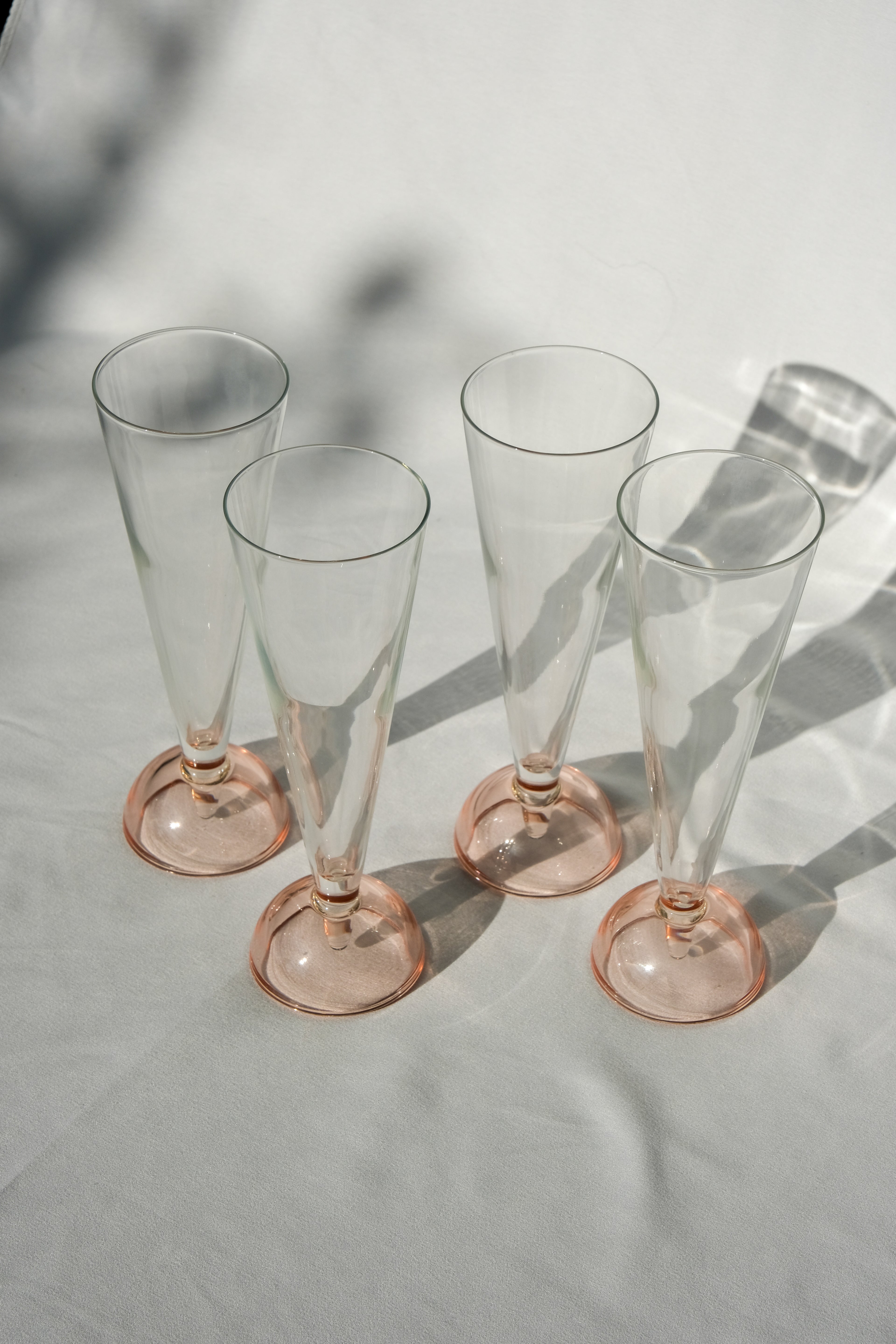 Set of four 90's flute glasses