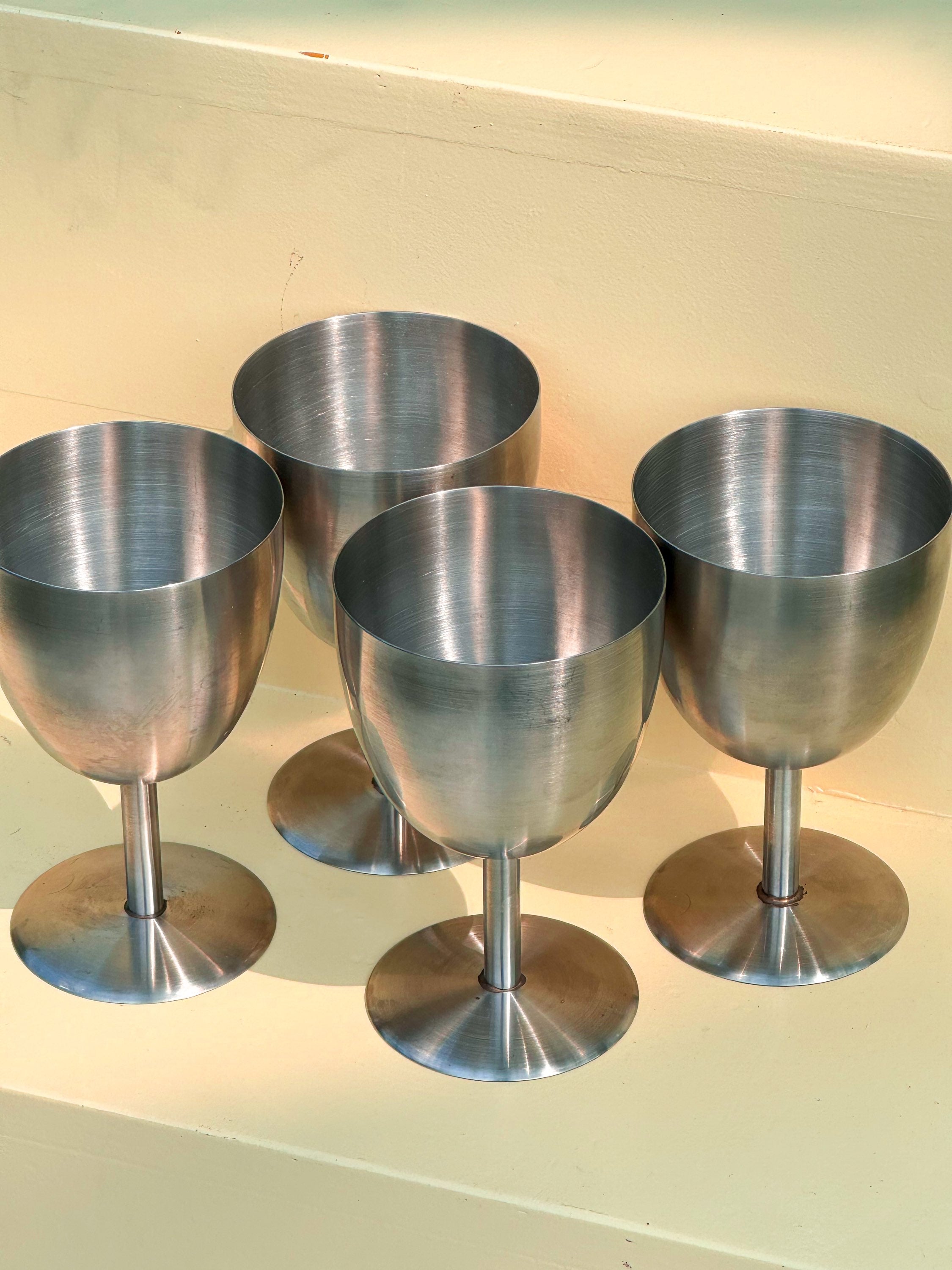 Set of four steel chalices