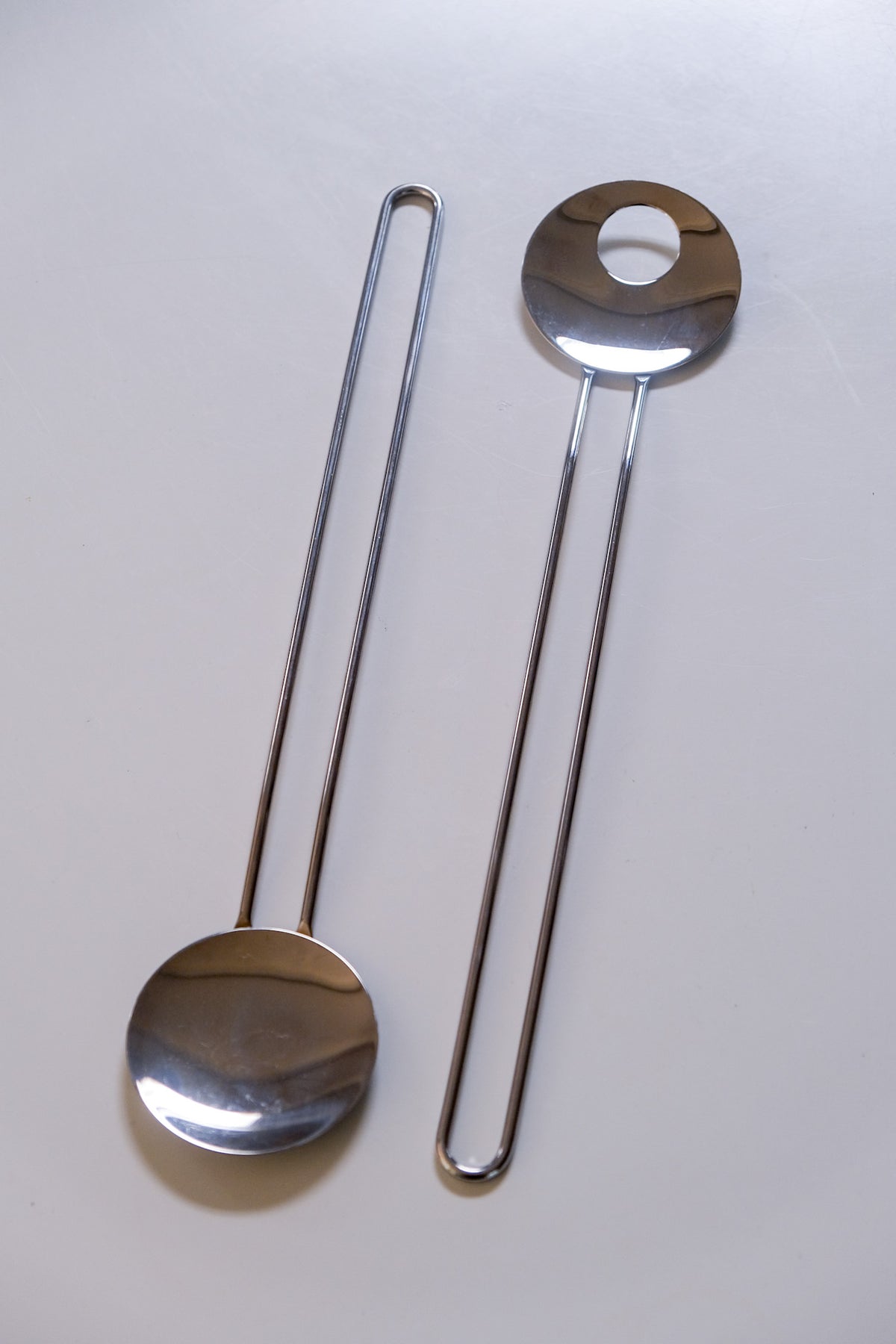 Modernist steel salad servers with wire handles