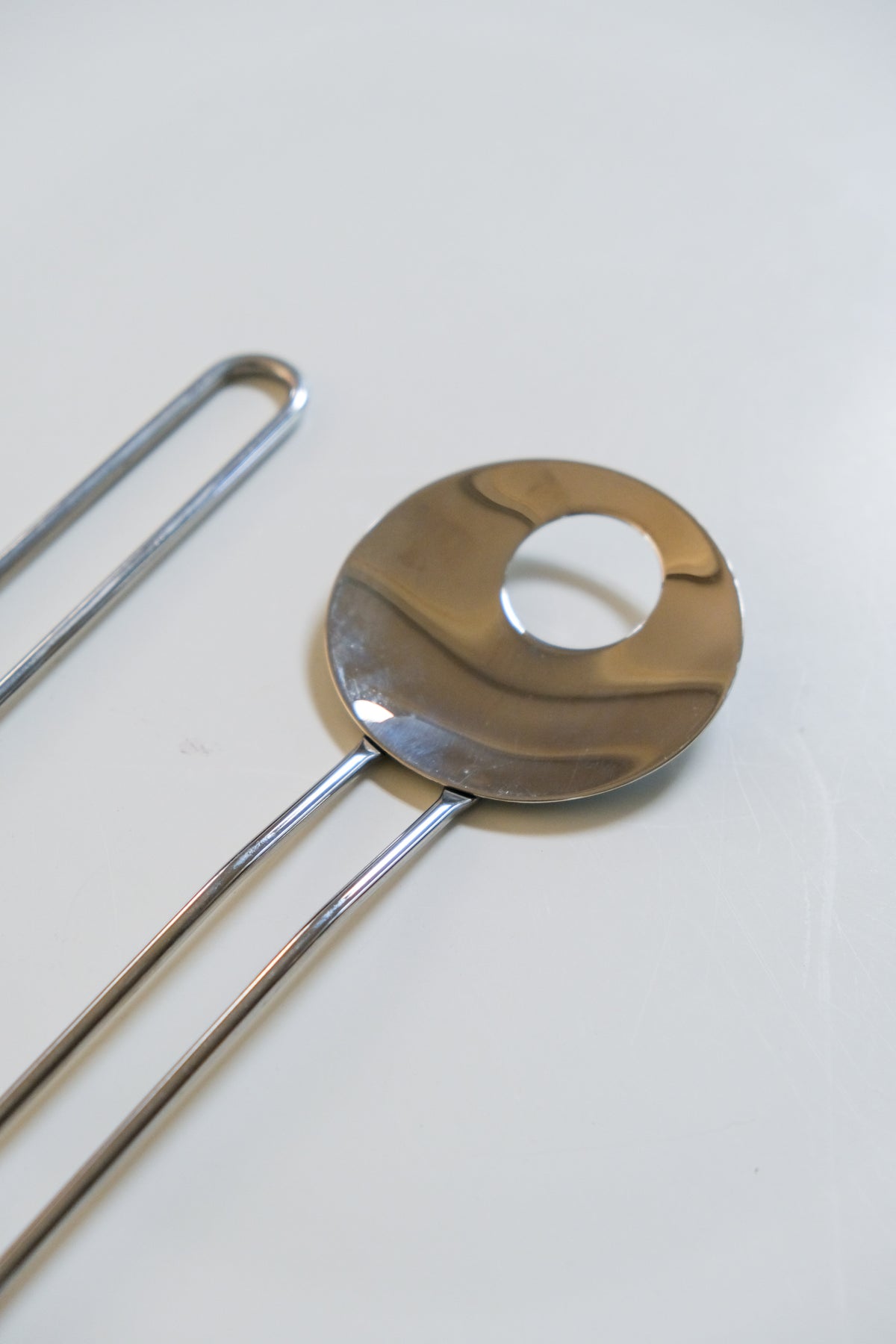Modernist steel salad servers with wire handles