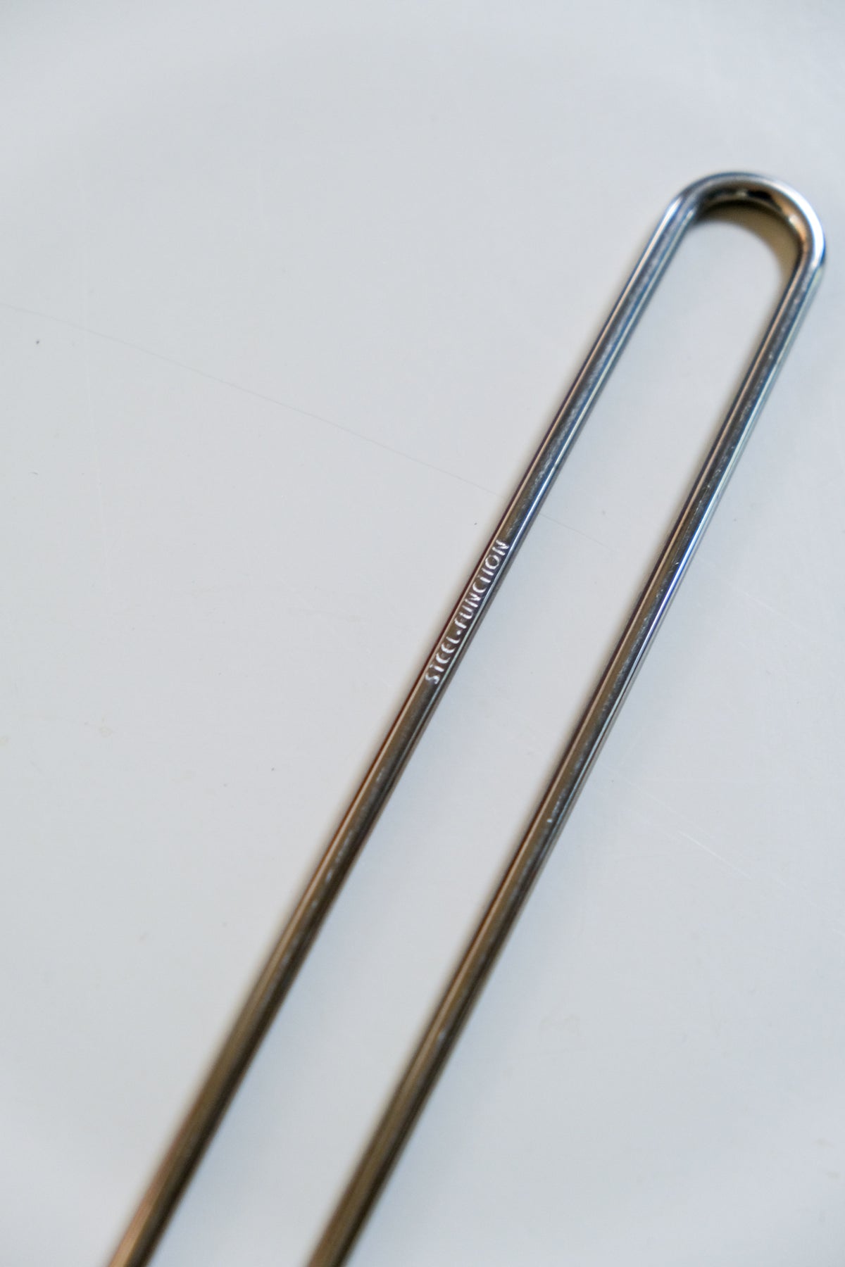 Modernist steel salad servers with wire handles