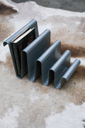 Wavy magazine holder